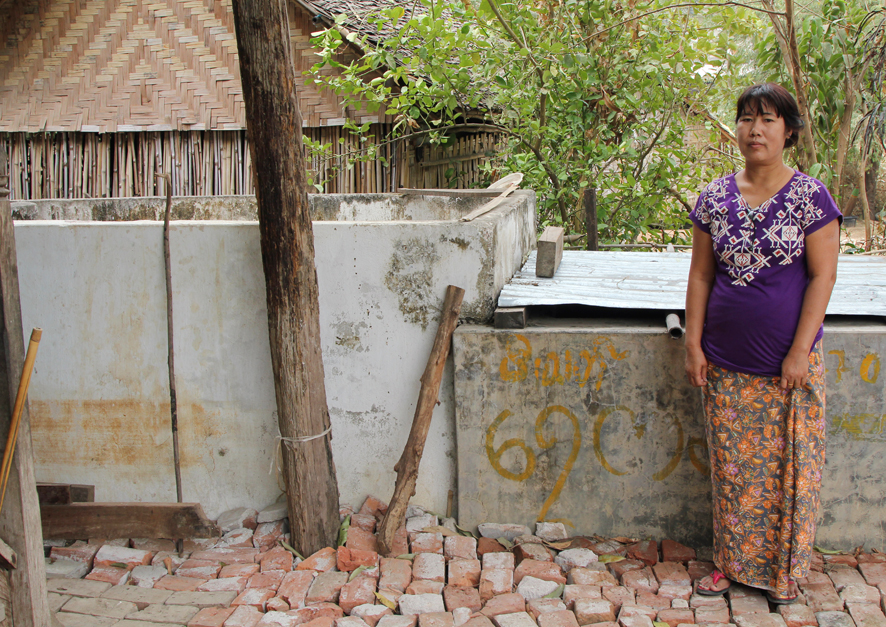 “My house is directly on the fault. The floor of my house was cut by deep fissures. I levelled the ground with bricks from a fallen wall. These wooden posts support my house and used to line up, but have been displaced by dextral slip. The water tank behind me used to be the same height as I am, but subsided during the earthquake.”