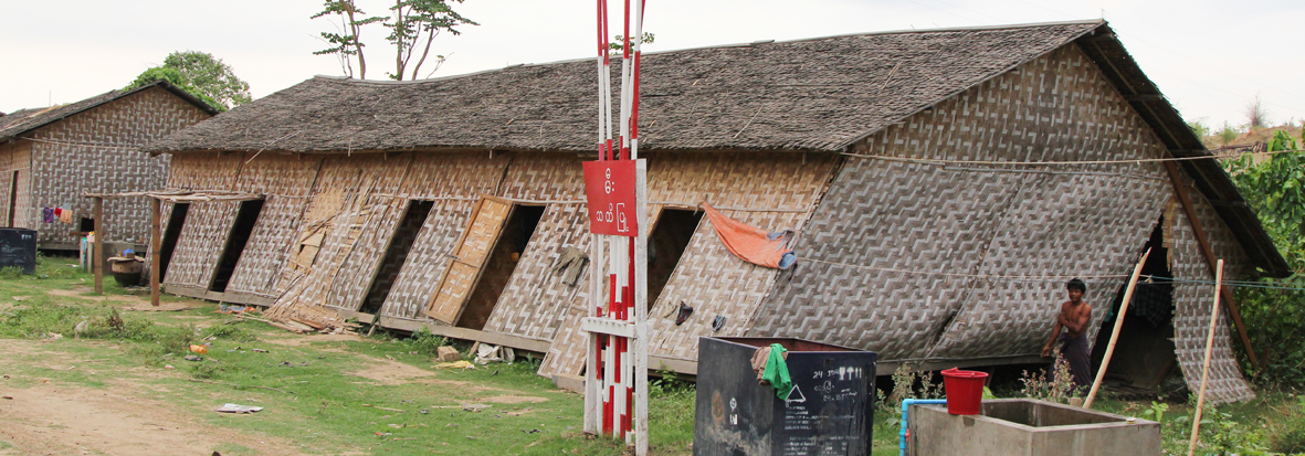 “I’m utilising my new side door, on my way to have an evening bath. My house is of the typical bamboo construction for this area. Although it is still habitable, like many similar buildings it was distorted and now requires more repair work than I can afford.”