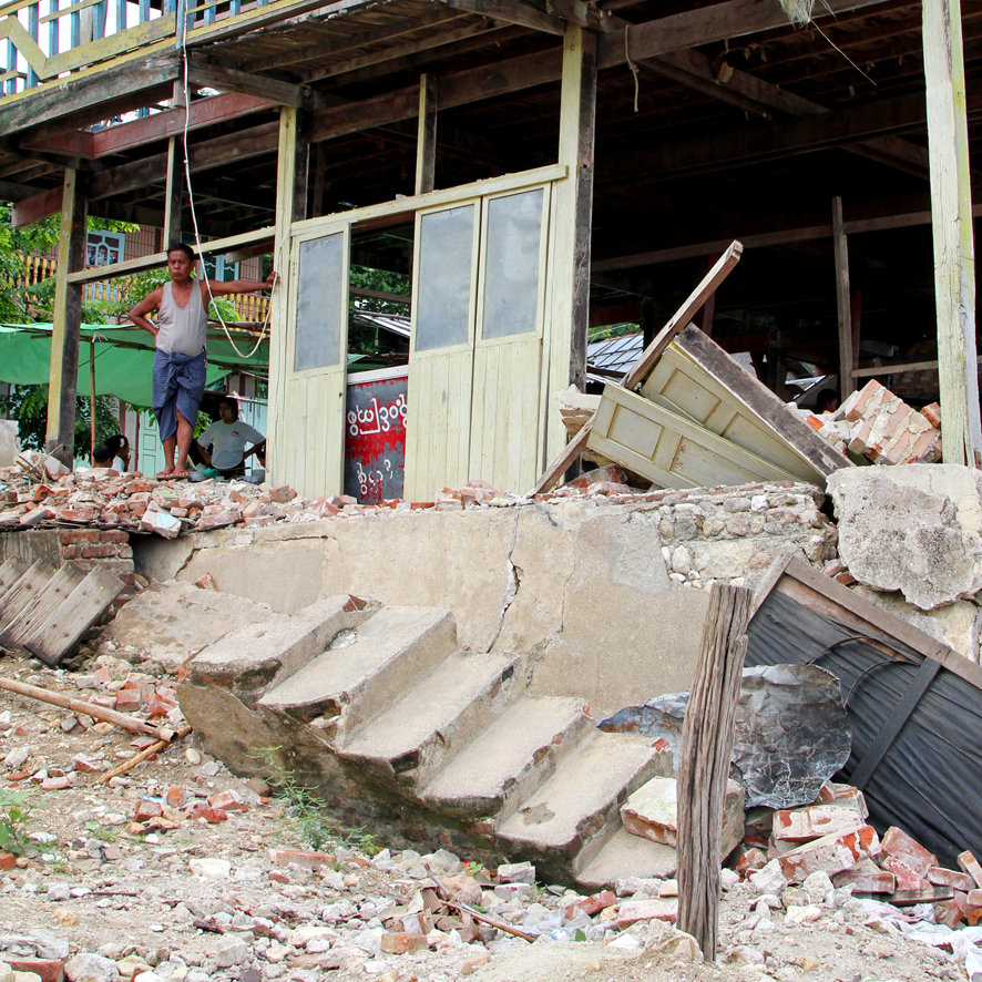 “My shop in Thabeikkyin city was built in the brick nogging style. Bricks filled the spaces between timbers but were not well tied to the frame so they were ejected during the shaking. Insurance is unheard of here so I continue to work from the ruins.”